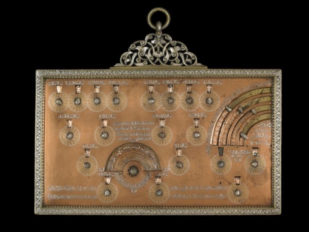 Geomantic tablet signed by Muhammad ibn Khutlukh al-Mawsili; owned by Muhammad al-Muhtasib al-Najjari (Probably from Damascus, Syria, 1241–42), brass alloy, inlaid with silver and gold (© Trustees of the British Museum)