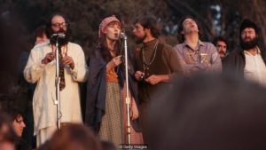 Beat poet, Allen Ginsberg addresses the Human Be-In with hippie singers backing him up. Golden Gate Park, San Francisco, California, USA. (Photo by Henry Diltz/Corbis via Getty Images)