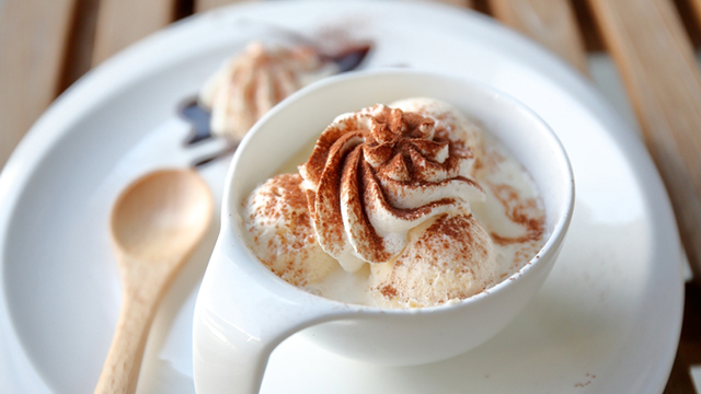 A bowl of frozen custard topped with cinnamon.