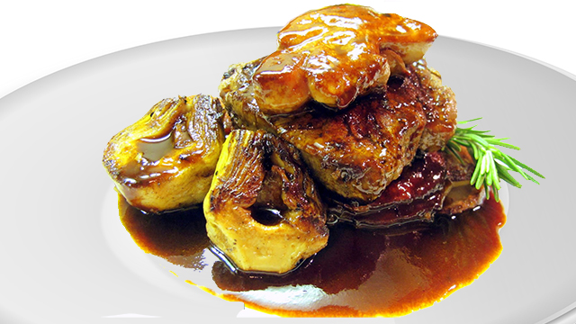 Filets Mignon topped with foie gras and served on potatoes and with artichokes