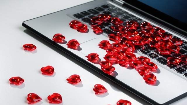 red candy hearts on a laptop keyboard