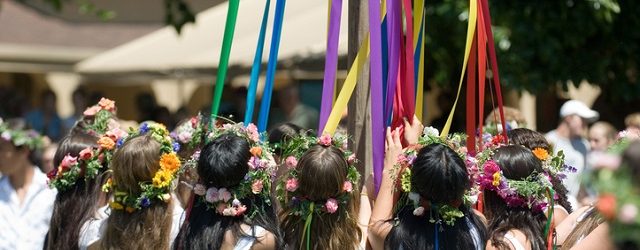 Maypole dancers gather around the Maypole