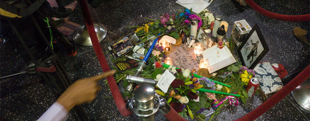 Hollywood, December 29, 2016: Tourists and camera teams around the candles and flowers on the star of Carrie Fisher on the sidewalk of Hollywood Boulevard.