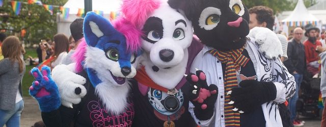 Malmö, Sweden - August 6, 2016: Three people at Malmö Pride Parade dressed as carton animals often referred as Furry fandom.