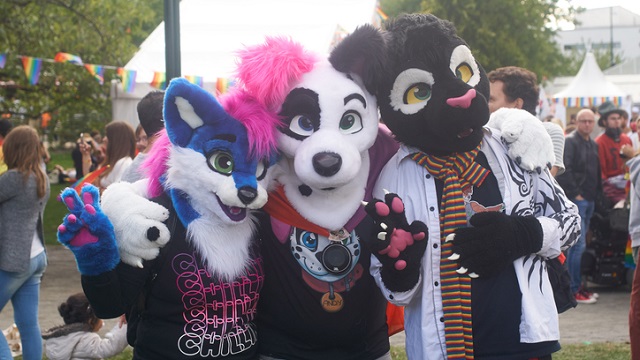 Malmö, Sweden - August 6, 2016: Three people at Malmö Pride Parade dressed as carton animals often referred as Furry fandom.