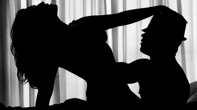 Sexy silhouette of a couple in bed.