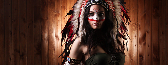 A woman wearing a headdress and face paint