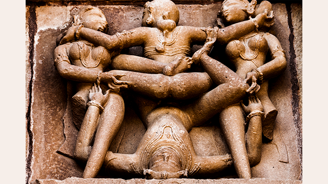 A statue in India depicting group sex. Photo via Flickr user Jack Zalium