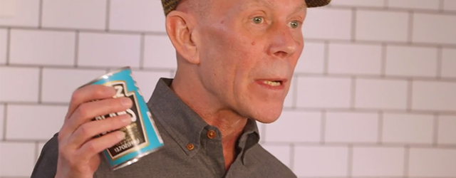 Vince Clarke holding a can of beans