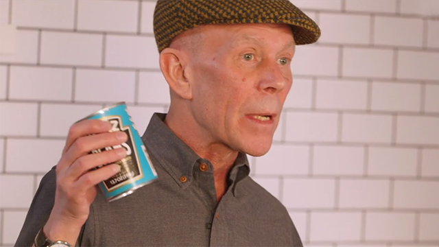 Vince Clarke holding a can of beans
