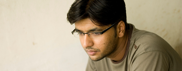 A young person sitting alone