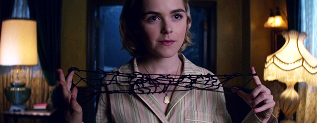 Sabrina Spellman creates a yarn cats cradle